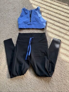 Peloton Blue Zip Sports Bra with Black High-Waist Leggings